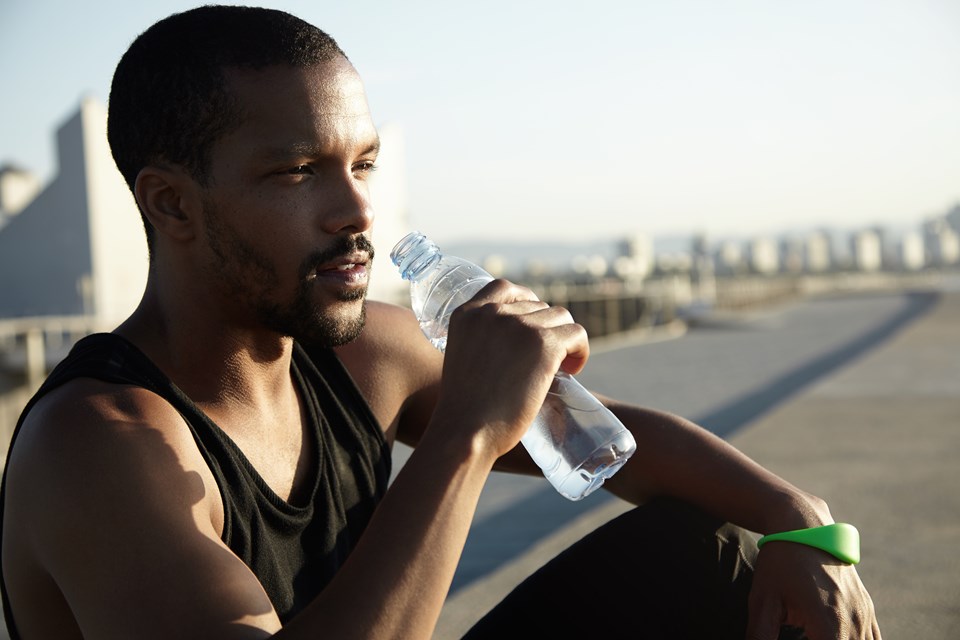closeup-portrait-young-bearded-man-drinking-water (1)