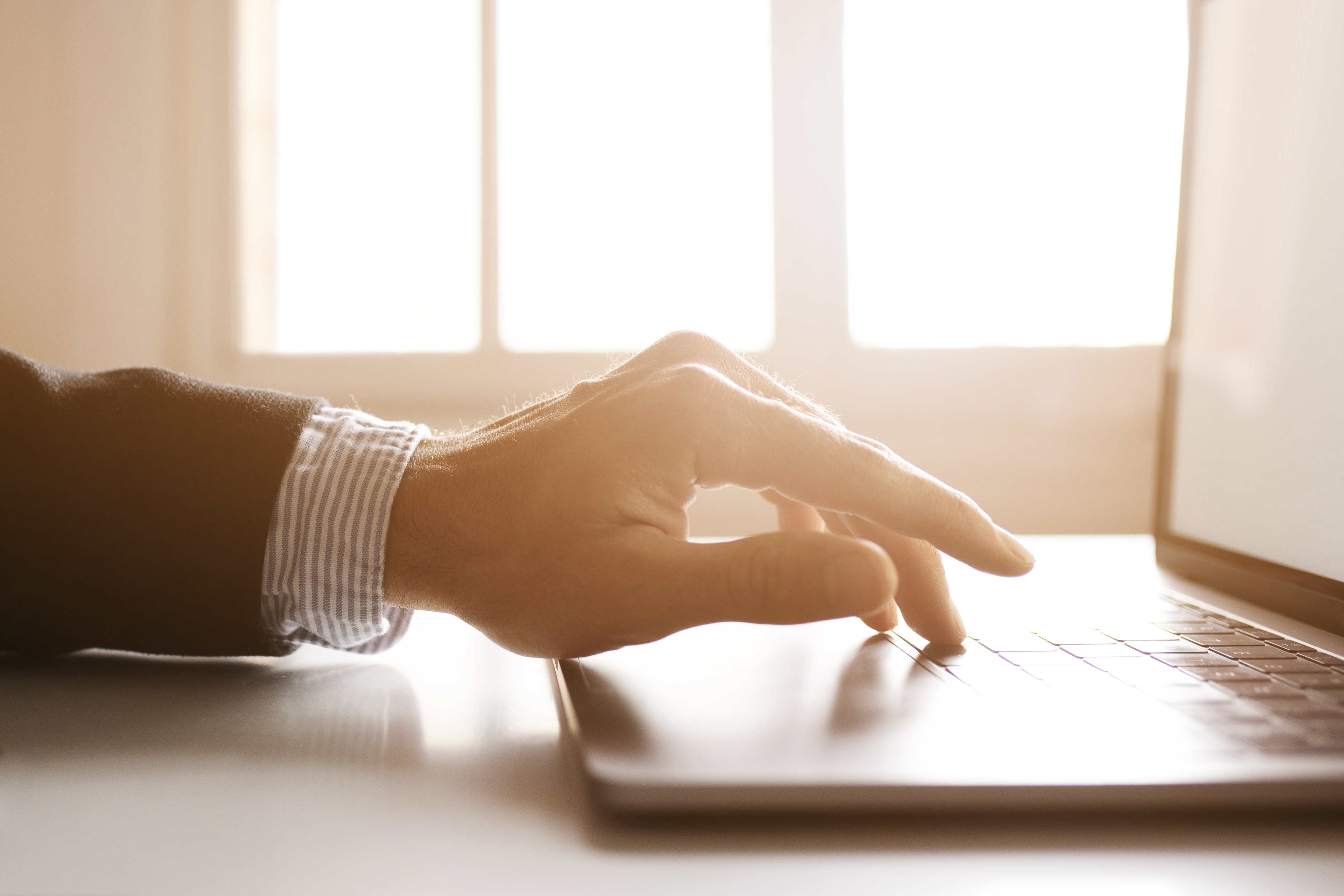 hands-of-a-businessman-using-laptop-on-the-internet (1)