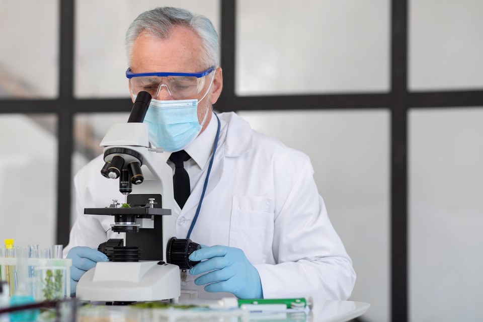 old-scientist-working-with-microscope