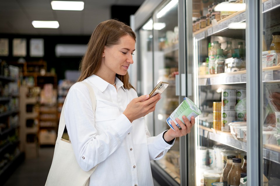 woman-checking-label-medium-shot (1)